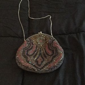 Multicolored beaded purse with chain.